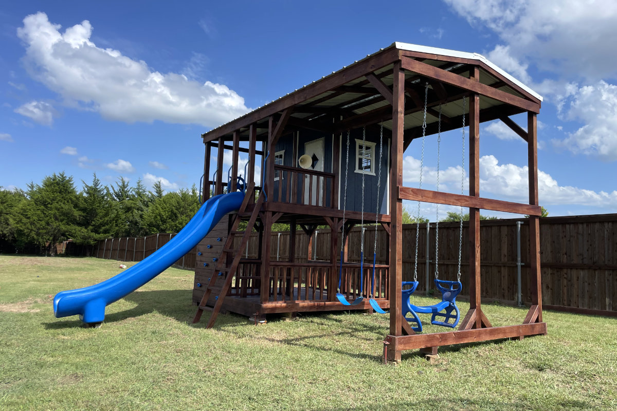 Playhouse playset in a family backyard